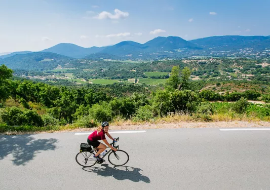 Backroads Guest Biking with Mountain and Land View