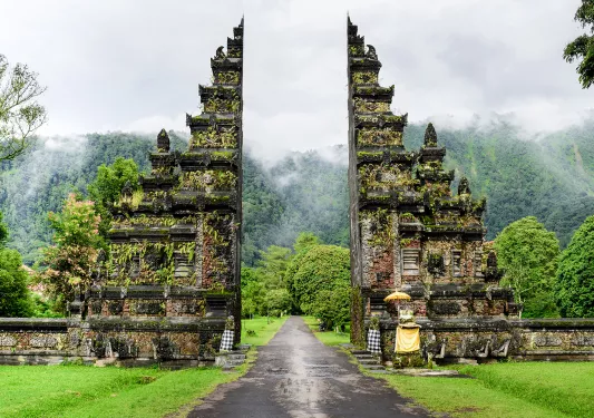 Shot of shrine/gateway in Bali, forest behind.