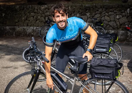 Backroads leader fixing e-bike.