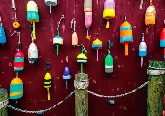 Wall of different colored buoys.