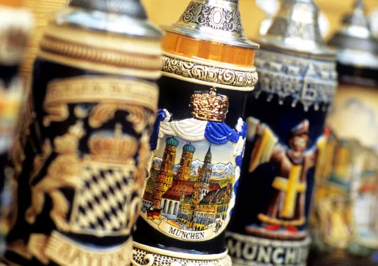 Ceramic beer steins in a row.