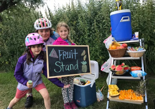 Kids posing at fruit stand snack table