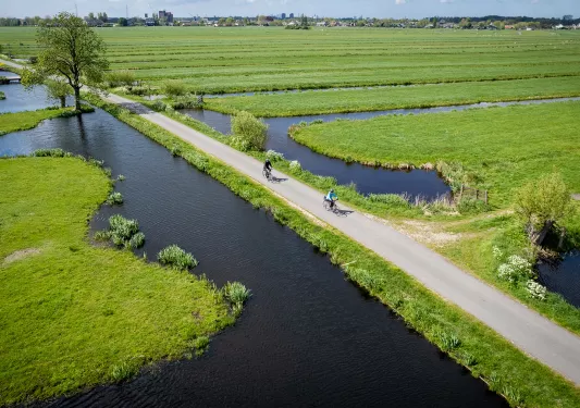 Ariel view of bikers in fields with ponds