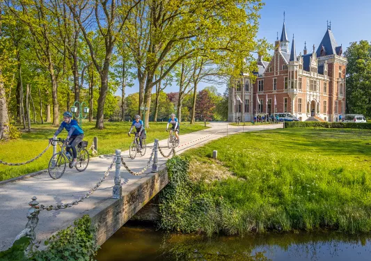 Bikers crossing footbridge