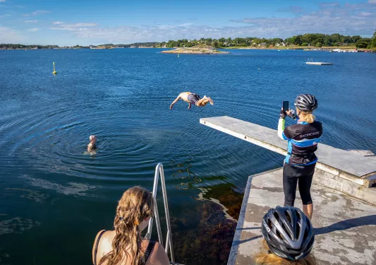 Guests diving into a river in Norway