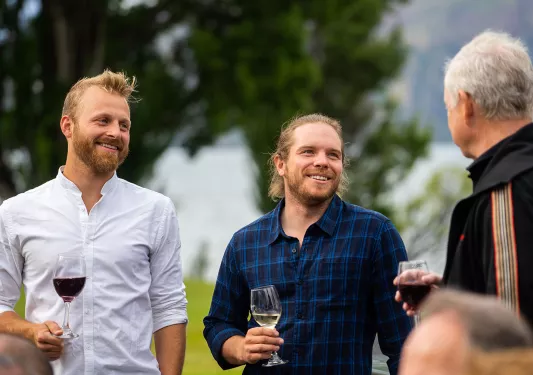 3 Men Talking and Drinking Wine in New Zealand