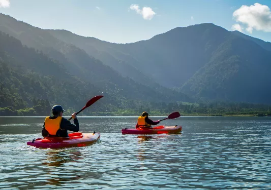 Asia & Pacific Kayaking on River with Mountain View