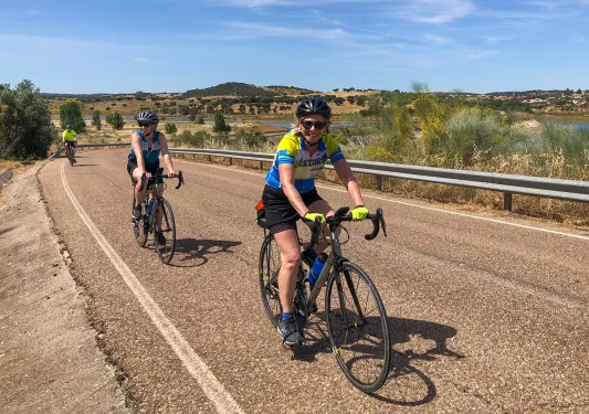 Three bikers riding on a road in Portugal.