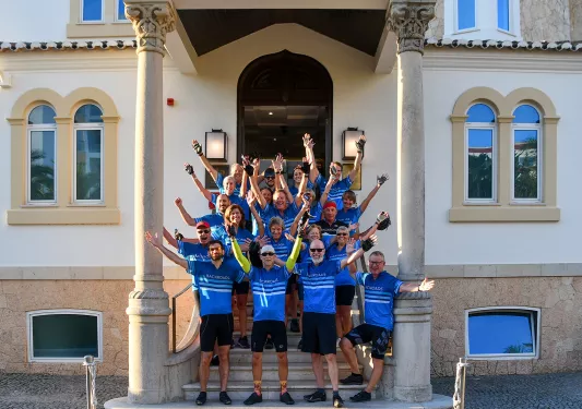 Backroads guests cheering, posing for photo.