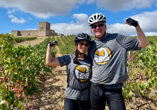 Two bikers posing in Vineyard.