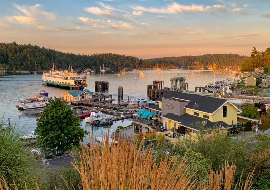Wide shot of ferry port at sundown.