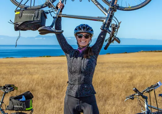 Guest holding bike over their head.