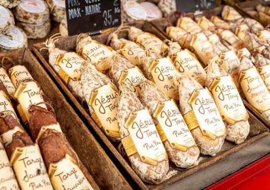 Close-up shot of wrapped cured meats.
