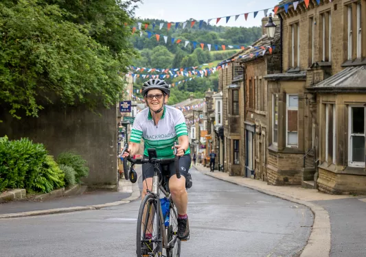 Guest Cycling Through Town Scotland