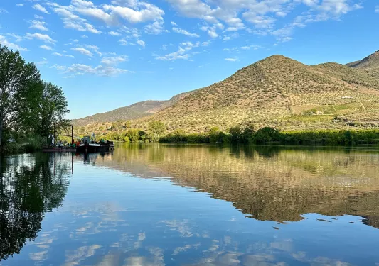 Clouds reflecting in crystal clear water