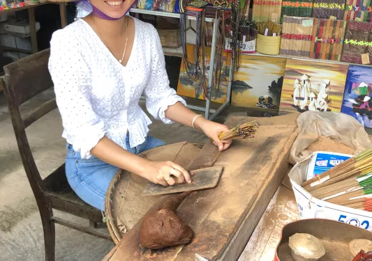 Local Vietnamese woman preparing food