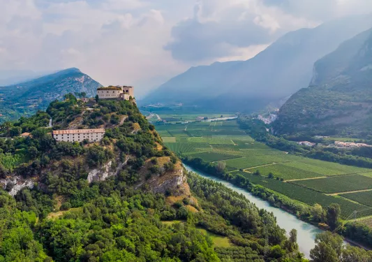 Village on a hill above a river in Italy