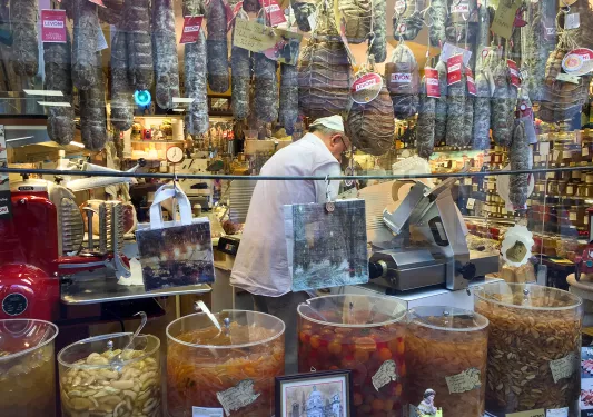 Shot of local butcher in his shop.
