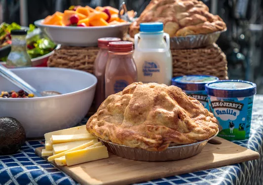 Shot of pie, ice cream, cheese, milk, salad, etc.