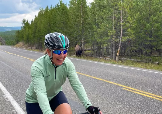 Backroads guest smiling while riding on road