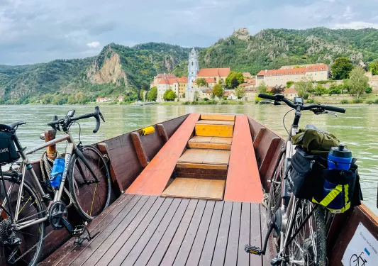 Two Backroads bikes loaded onto a boat on the water.