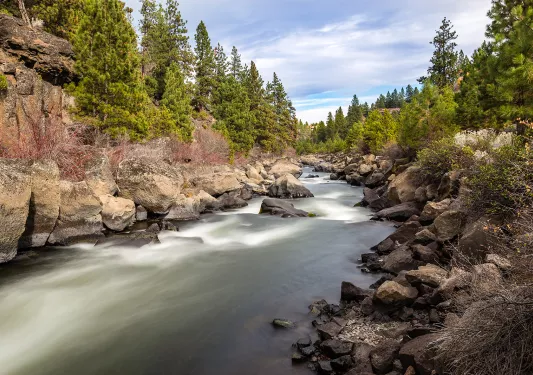Wide shot of quickly flowing river.