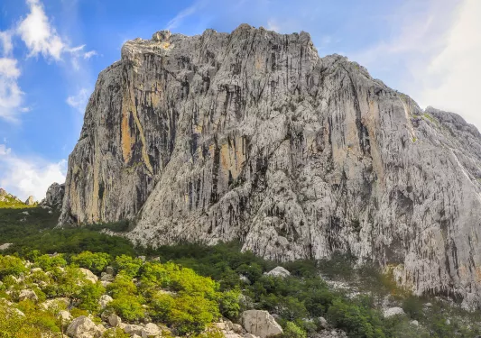 Wide shot of white, craggy cliffside.
