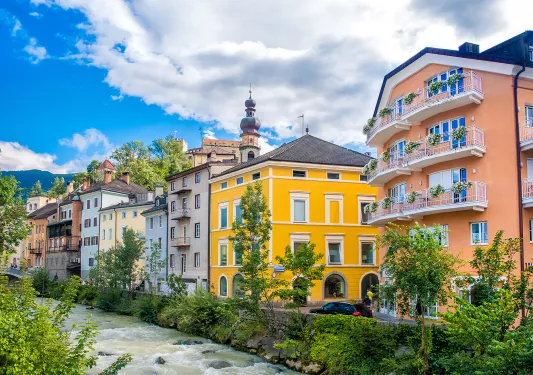 Houses along the Brunico Bruneck River.