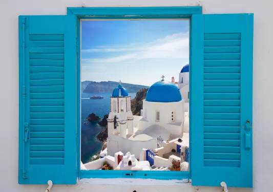 Light blue windowsill, overlooking blue and white Mediterranean domed houses.