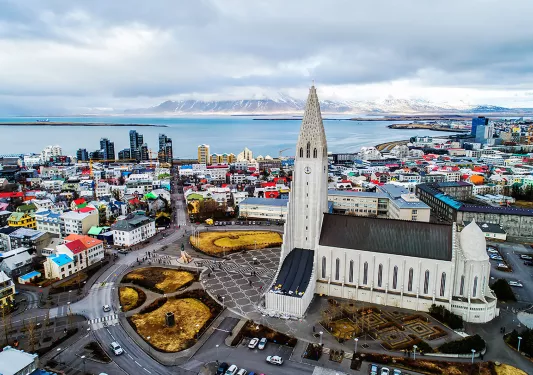 Bird's eye shot of The Hallgrimskirkja and it's surrounding city.