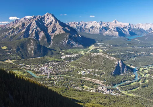 Bird's eye shot of Banff among the mountains.