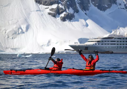 Kayakers in the icy waters of Antarctica