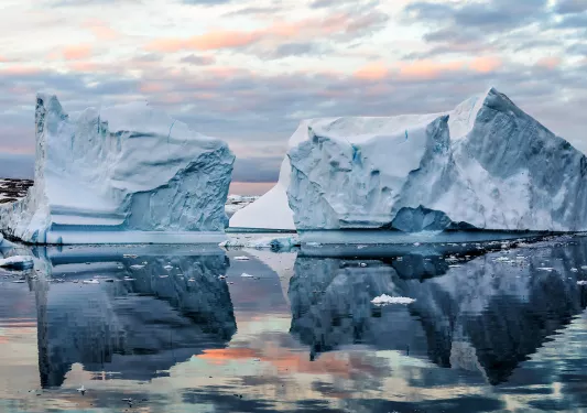 Icebergs floating in icy waters of Antarctica