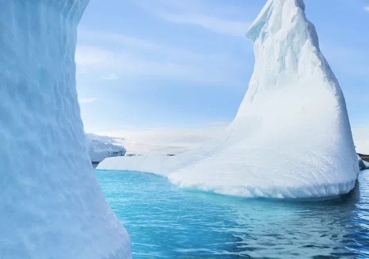 Icebergs floating in icy waters of Antarctica