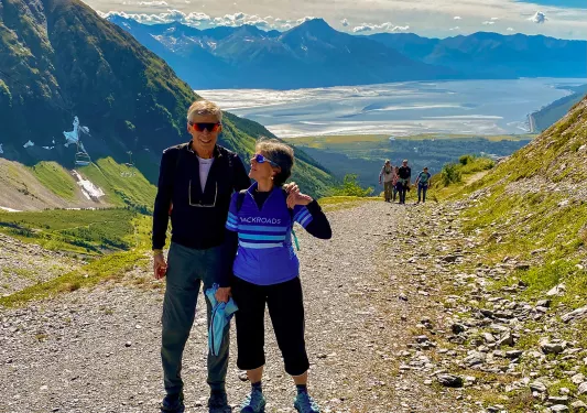 Guests on gravel path in the mountains