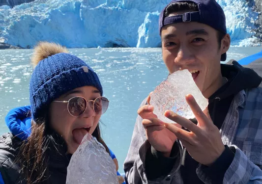 Two guests eating ice in Alaska