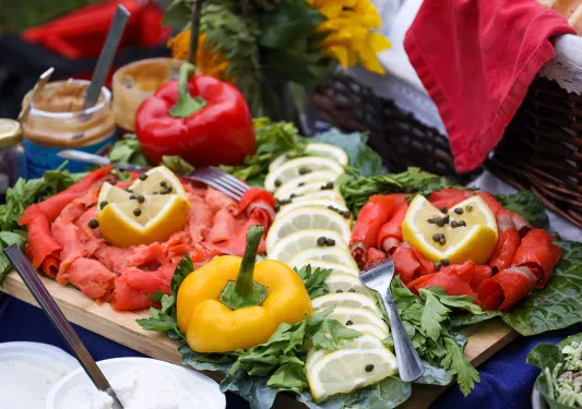 Platter of smoked salmon and vegetables.