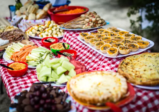 Lunch spread, fruit, veggies, quiche, kabobs, etc.