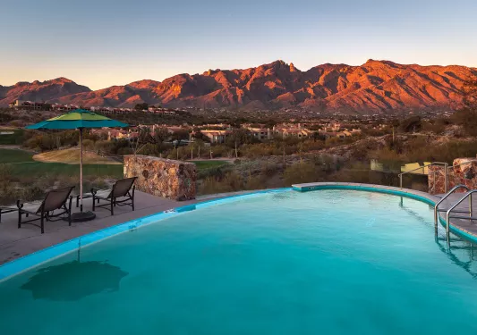 Pool shot AZ at sunset with mountain landscape