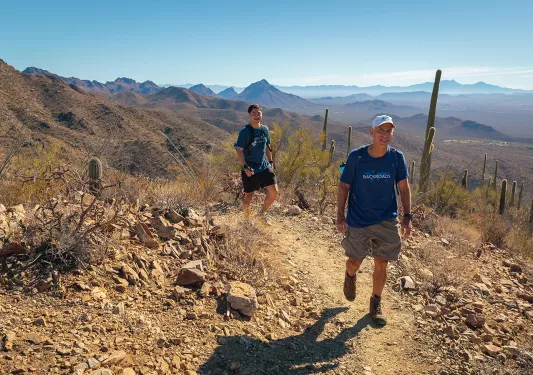 Man and boy hiking in desert AZ 