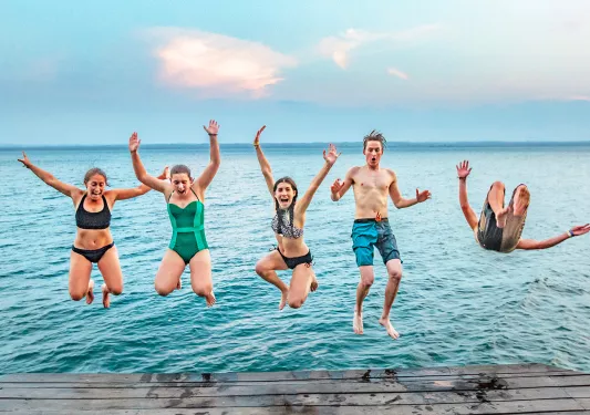 Guests Jumping Off of  Dock Belize