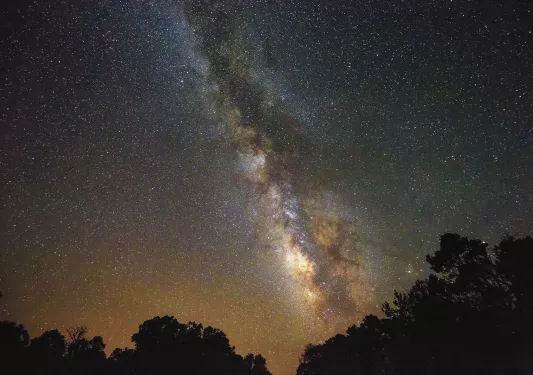 Shot of the night sky, bright line of stars.