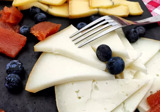 Close-up of cheese and fruit platter.