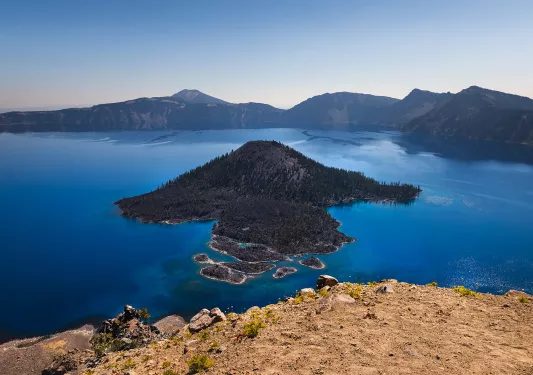 Wide shot of Wizard Island in Crater Lake.