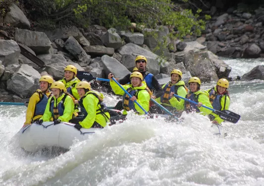 Group of guests white-water rafting.