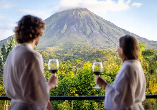 Enjoying Wine Looking up Arenal Volcano Costa Rica