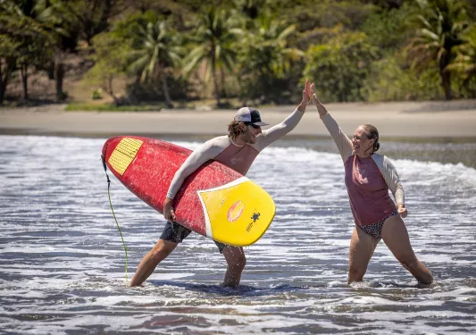 Hi Five After Surfing Instructor Student Costa Rica
