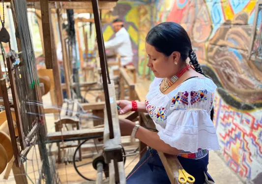 Woman Weaving Blanket