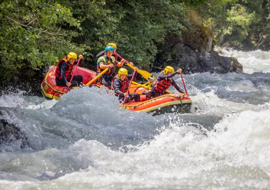 Five guests white water rafting.