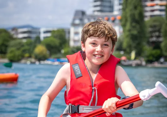 Young guest on paddle board.
